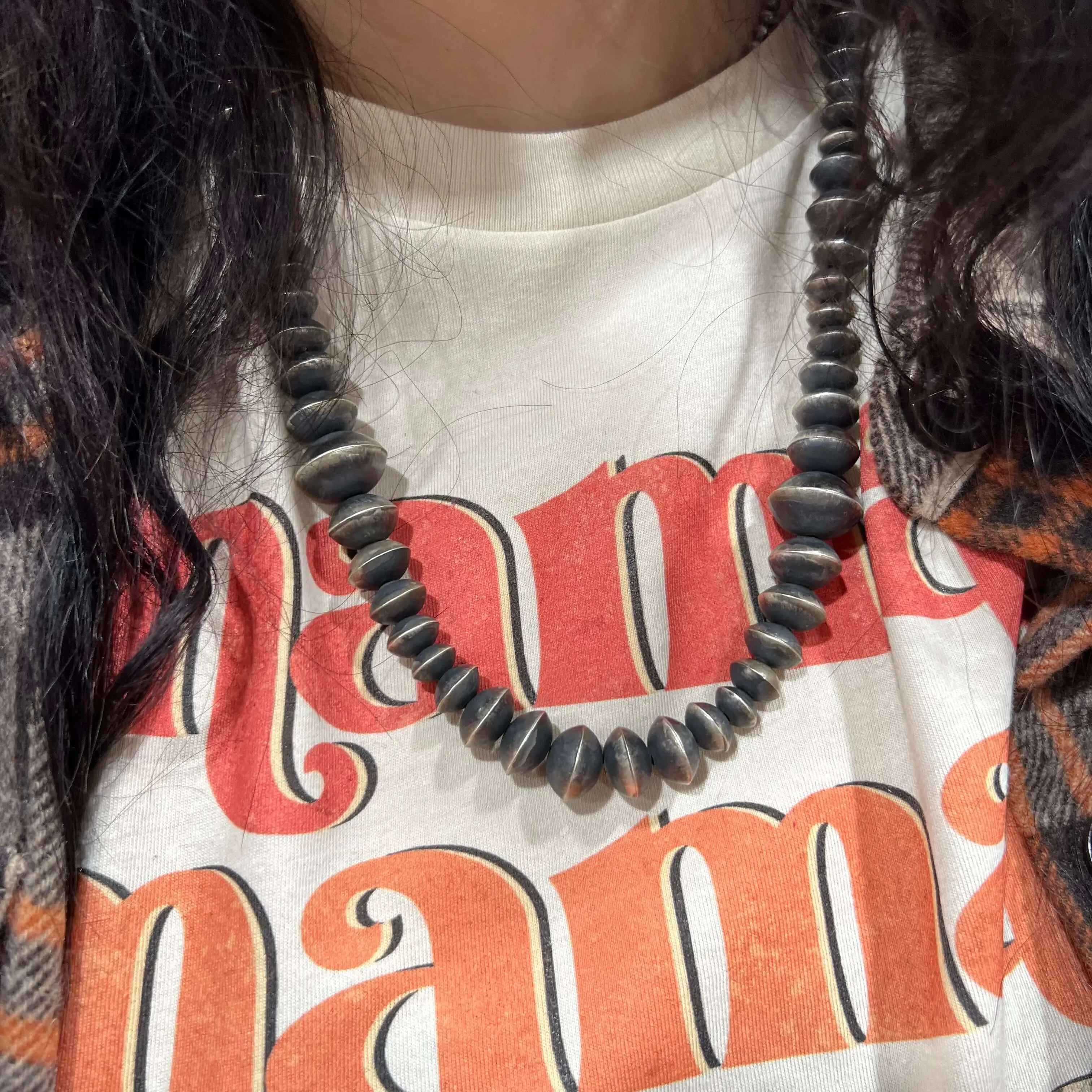25 Inch 9mm-16mm Patterned Disc Genuine Necklace.